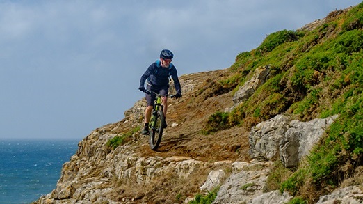 Man riding a bike in the countryside