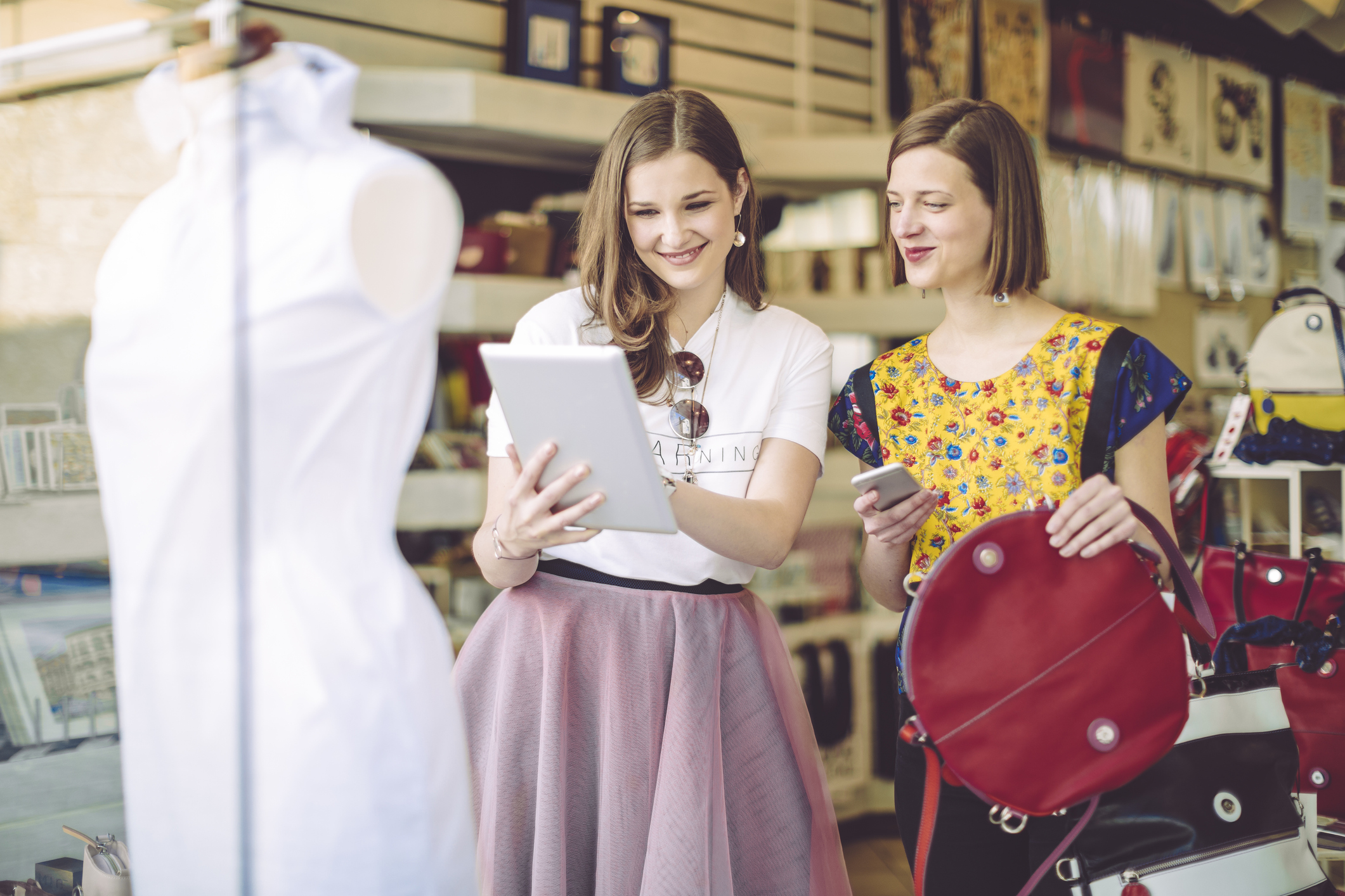 Two woman discussing a purchase in a clothing shop 