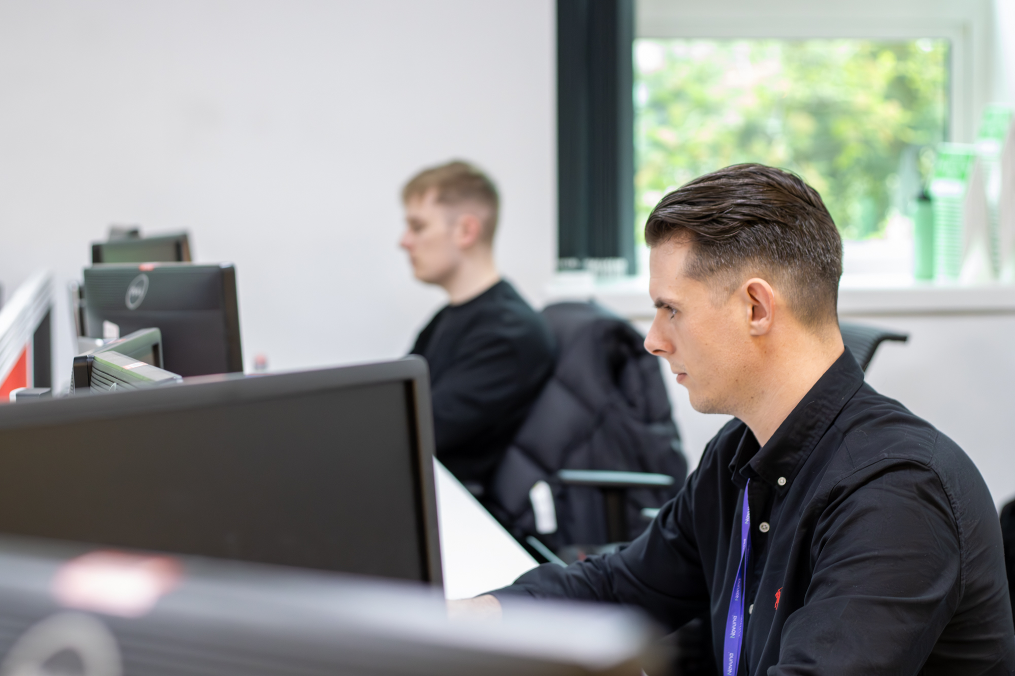 Senior Business Development Manager, Max Walker, working on a computer