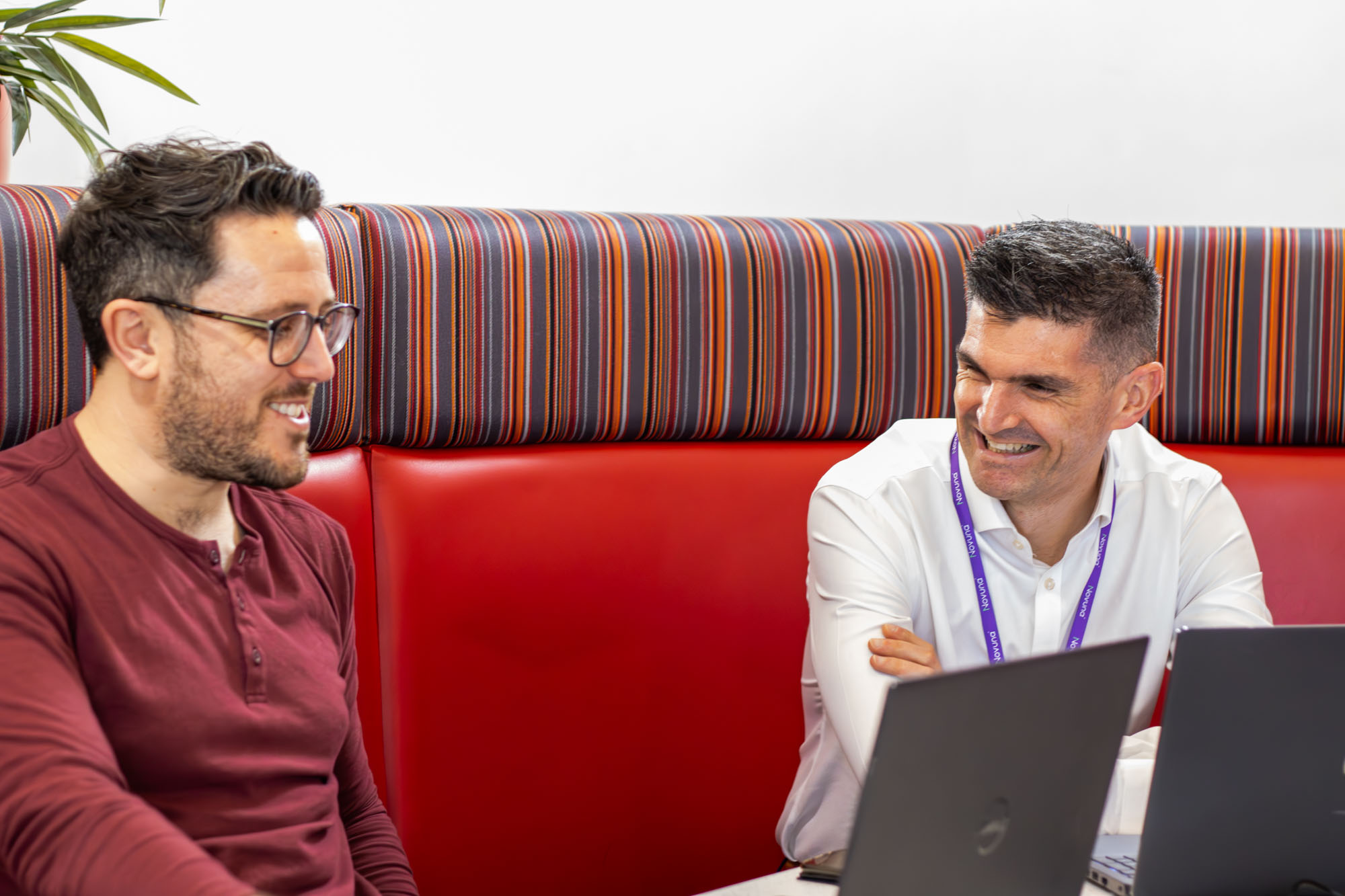 Two members of the Novuna e-commerce team having a meeting